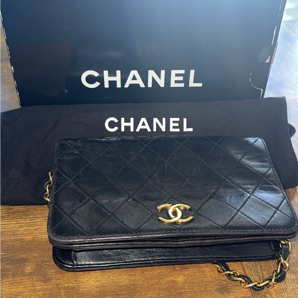 CHANEL Black Quilted Wristlet with Gold Logo